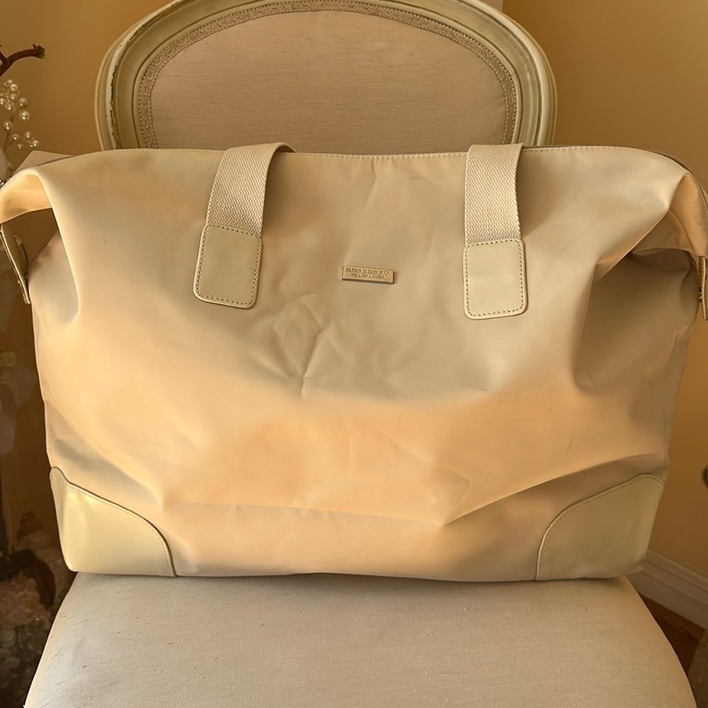 Burberry fragrance duffel bag.